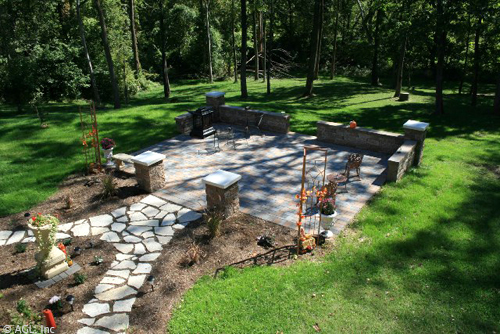 cobble stone patio with seat walls and columns