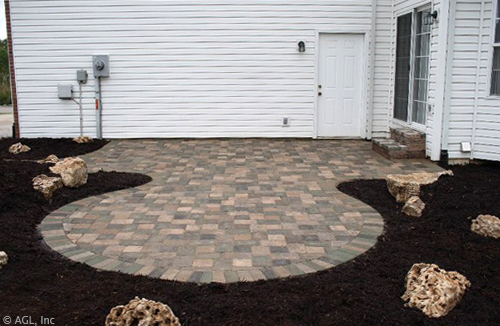 custom paver patio with cobblestone