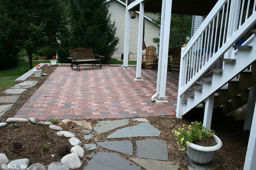 cobblestone patio with deck steps