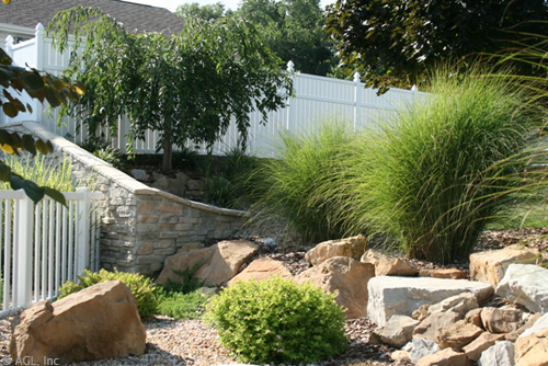 stone wall boulders and grasses