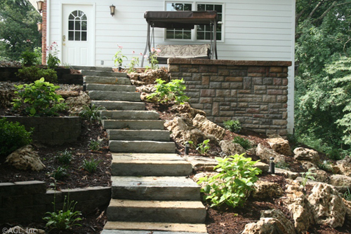 landscaped hill, stone brick wall,stone steps, boulders