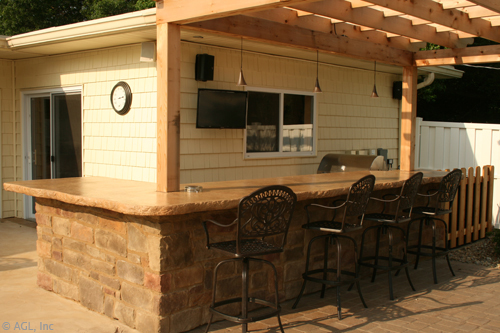 custom outdoor bar with seating and tv